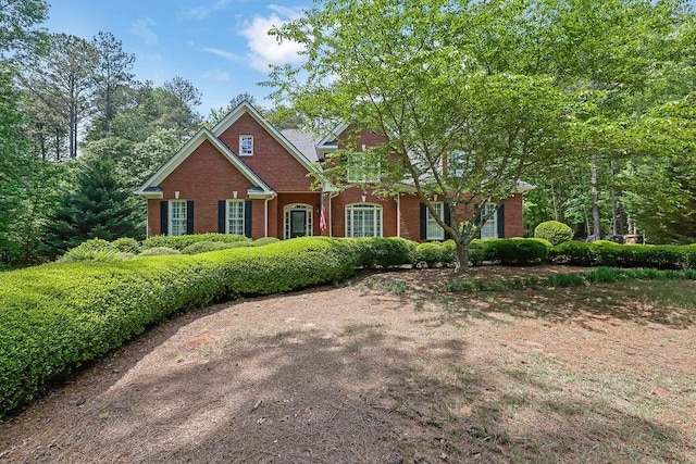 view of front facade featuring brick siding