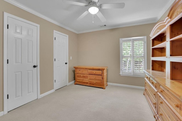 bedroom featuring baseboards, crown molding, visible vents, and light carpet