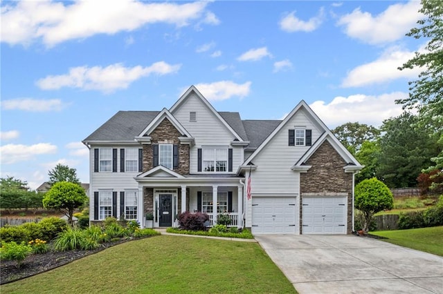 121 Bradshaw Park Dr, Woodstock, GA 30188 - craftsman-style house with stone siding, concrete driveway, an attached garage, and a front yard