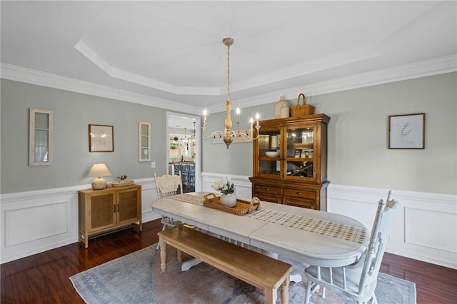 121 Bradshaw Park Dr, Woodstock, GA 30188 - dining space with a tray ceiling, a chandelier, a decorative wall, dark wood finished floors, and wainscoting