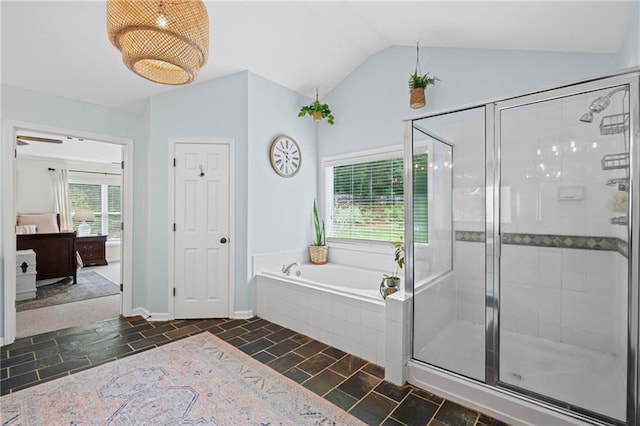 121 Bradshaw Park Dr, Woodstock, GA 30188 - bathroom with lofted ceiling, a stall shower, a bath, and baseboards