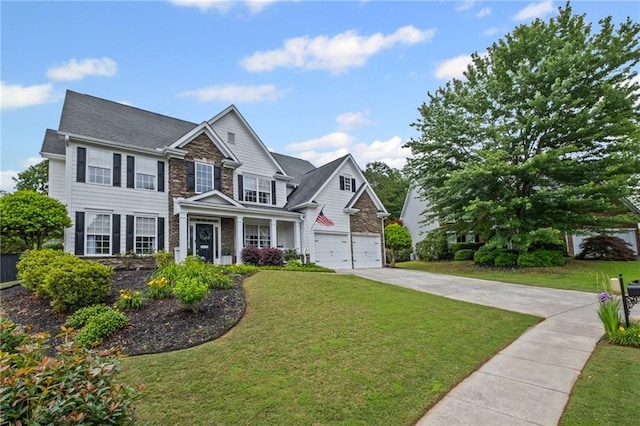 121 Bradshaw Park Dr, Woodstock, GA 30188 - view of front of property with stone siding, concrete driveway, a front yard, and a garage