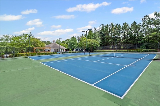 121 Bradshaw Park Dr, Woodstock, GA 30188 - view of tennis court featuring view of wooded area