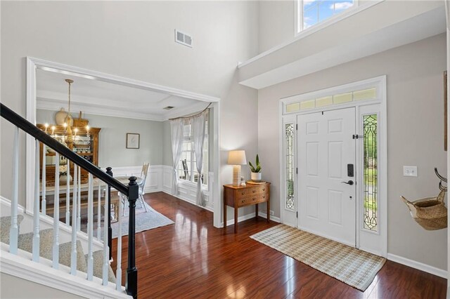 121 Bradshaw Park Dr, Woodstock, GA 30188 - entryway with a chandelier, plenty of natural light, wood finished floors, stairway, and a towering ceiling