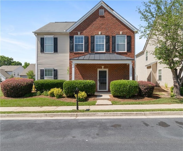 3223 Tallon Ln SW, Atlanta, GA 30311 - traditional-style house featuring brick siding and a standing seam roof