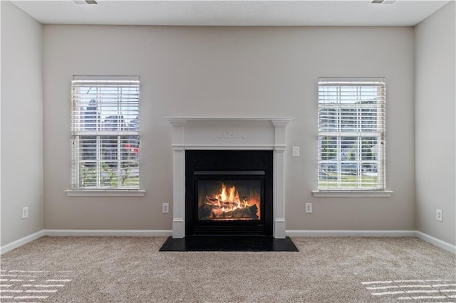 3223 Tallon Ln SW, Atlanta, GA 30311 - detailed view of a fireplace with flush hearth, carpet floors, and baseboards
