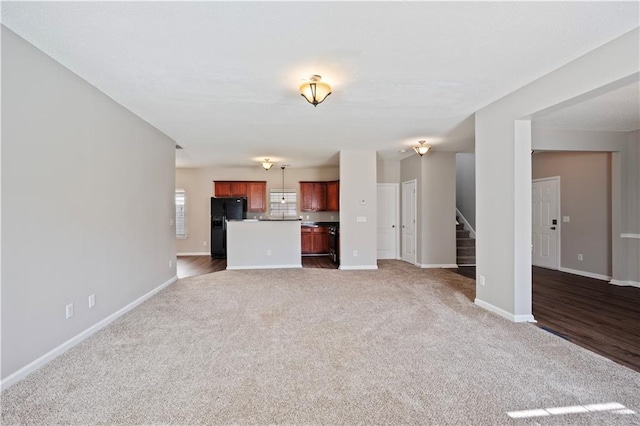 3223 Tallon Ln SW, Atlanta, GA 30311 - unfurnished living room with carpet floors, stairs, and baseboards