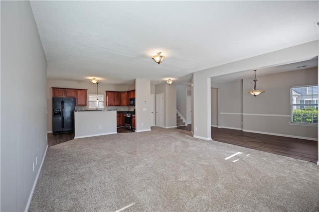 3223 Tallon Ln SW, Atlanta, GA 30311 - unfurnished living room with carpet floors, stairway, and baseboards