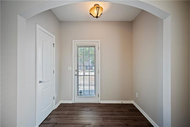 3223 Tallon Ln SW, Atlanta, GA 30311 - entryway featuring dark wood-style flooring, baseboards, and arched walkways