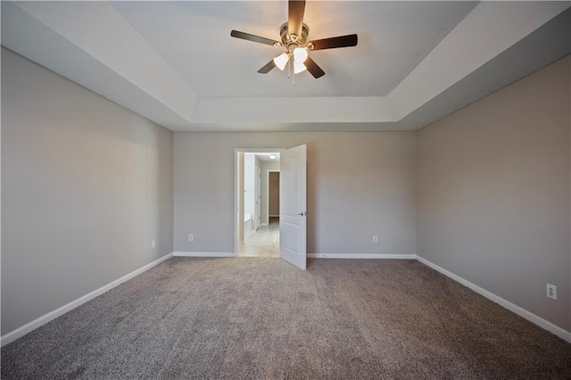 3223 Tallon Ln SW, Atlanta, GA 30311 - carpeted spare room with a tray ceiling, ceiling fan, and baseboards