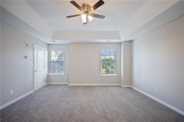 3223 Tallon Ln SW, Atlanta, GA 30311 - carpeted empty room featuring a raised ceiling, plenty of natural light, and ceiling fan