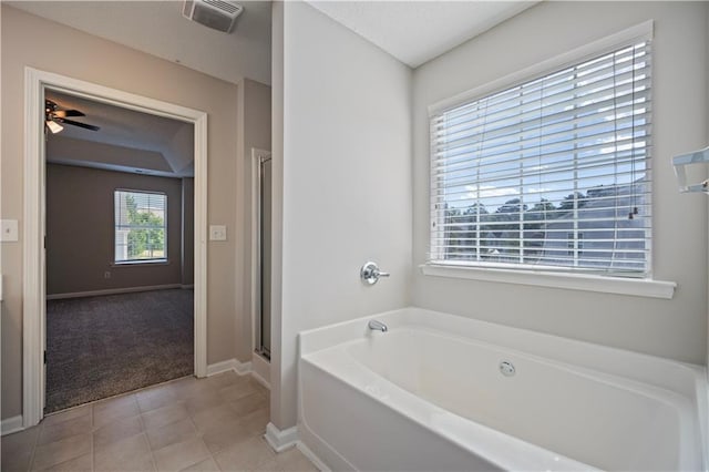 3223 Tallon Ln SW, Atlanta, GA 30311 - bathroom featuring a garden tub, baseboards, a stall shower, ceiling fan, and tile patterned floors