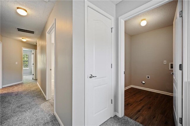 3223 Tallon Ln SW, Atlanta, GA 30311 - hallway featuring a textured ceiling, baseboards, and wood finished floors