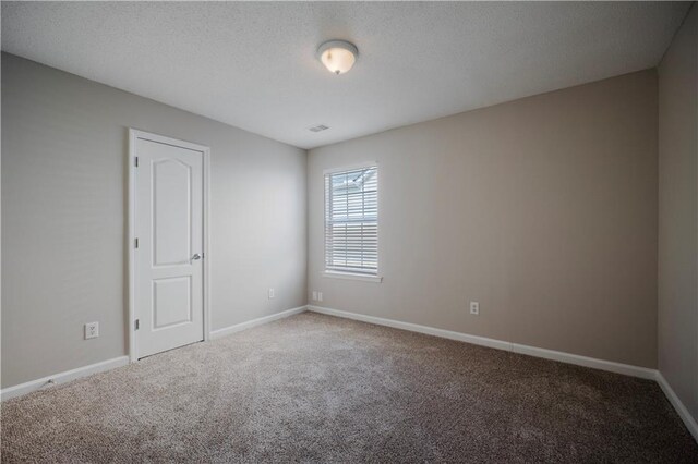 3223 Tallon Ln SW, Atlanta, GA 30311 - carpeted empty room featuring baseboards and a textured ceiling
