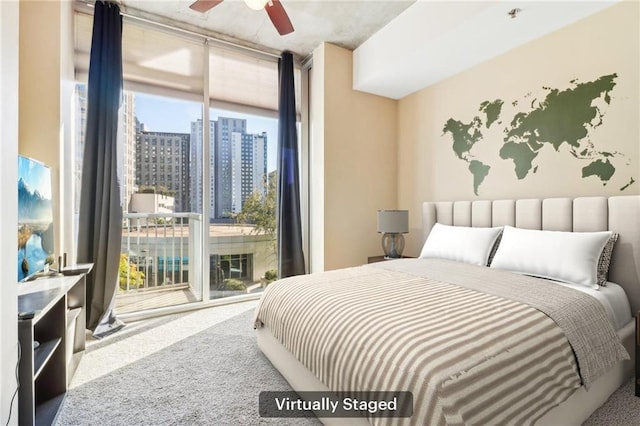 carpeted bedroom with ceiling fan, access to outside, and multiple windows