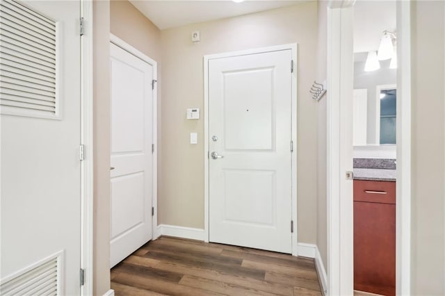 doorway featuring dark hardwood / wood-style flooring