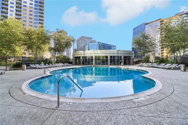 view of swimming pool with a patio area