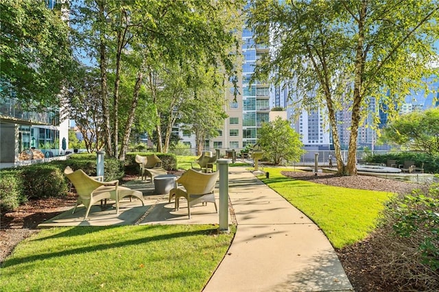 view of property's community featuring a yard