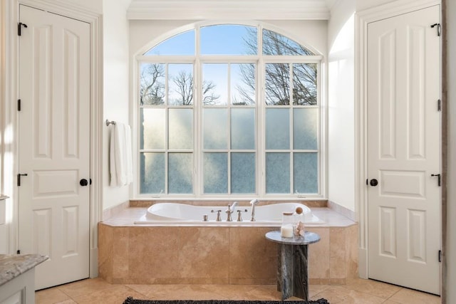 bathroom featuring tile patterned flooring and tiled tub