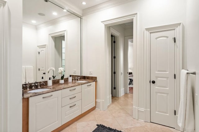 bathroom featuring crown molding, vanity, and tile patterned flooring