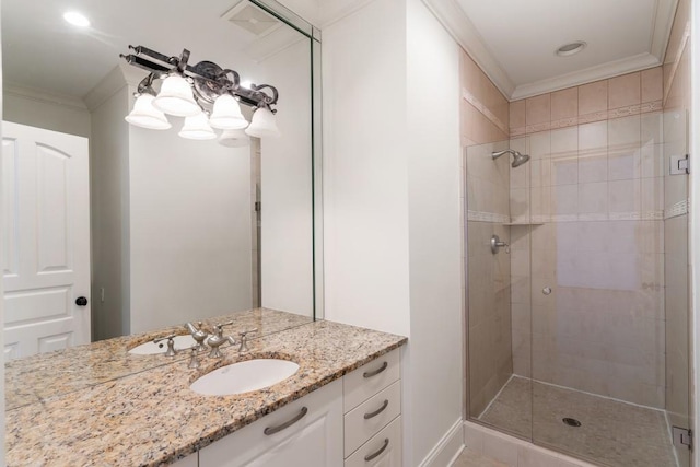 bathroom with ornamental molding, a shower with shower door, and vanity