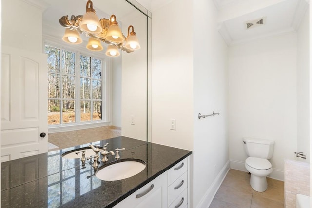 bathroom featuring toilet, a chandelier, ornamental molding, vanity, and tile patterned flooring