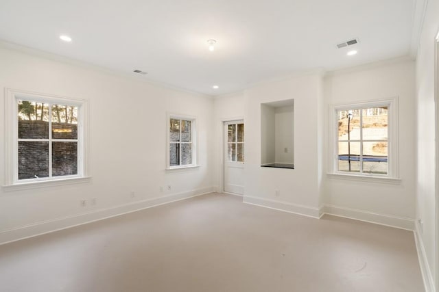 spare room with crown molding and a healthy amount of sunlight