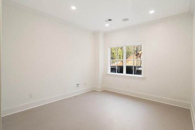 unfurnished room featuring crown molding