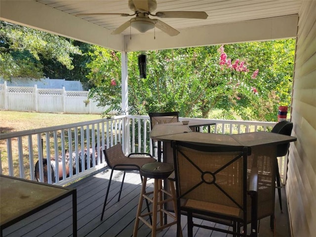 wooden deck featuring ceiling fan