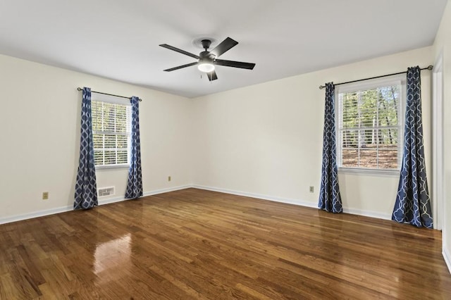 unfurnished room with ceiling fan and dark hardwood / wood-style flooring