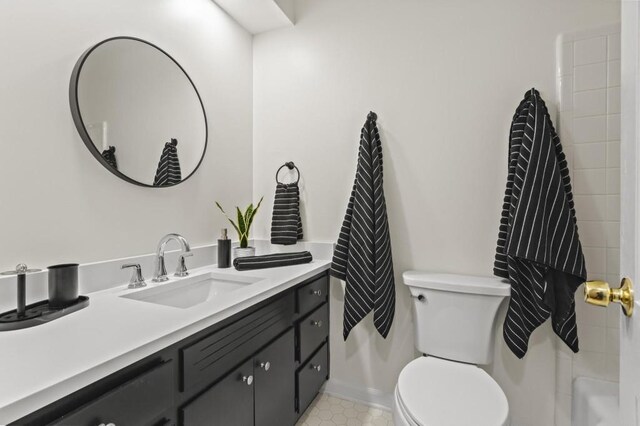 bathroom featuring vanity and toilet