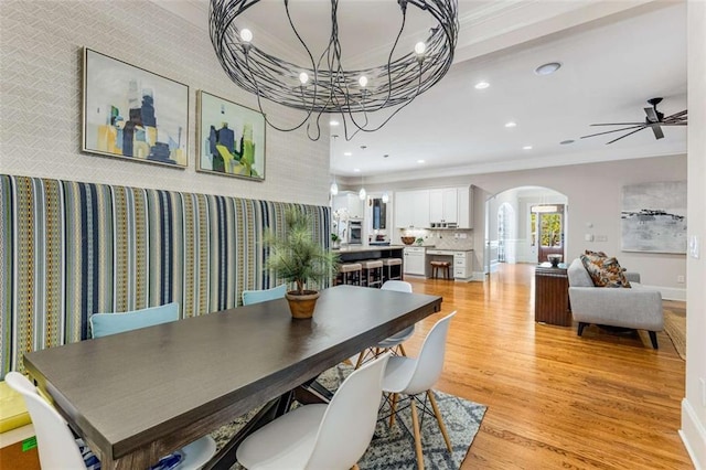 504 S Westminster Way NE, Atlanta, GA 30307 - dining space with arched walkways, light wood finished floors, recessed lighting, a chandelier, and a ceiling fan