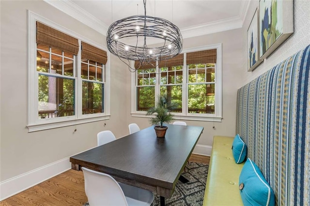 504 S Westminster Way NE, Atlanta, GA 30307 - dining space featuring a chandelier, baseboards, crown molding, and wood finished floors