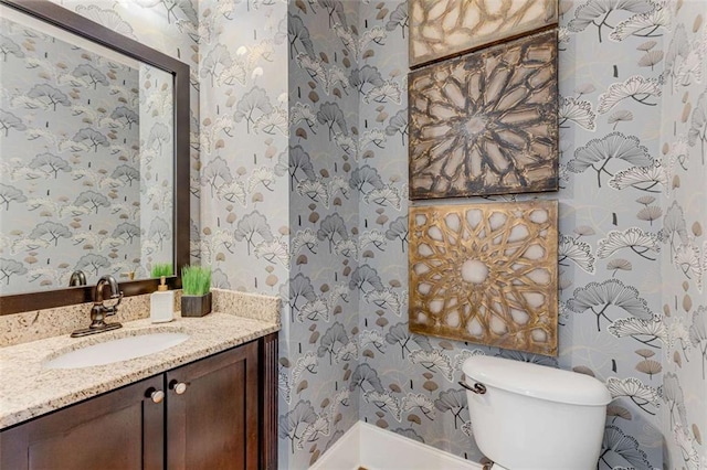 504 S Westminster Way NE, Atlanta, GA 30307 - bathroom featuring wallpapered walls, toilet, vanity, and baseboards