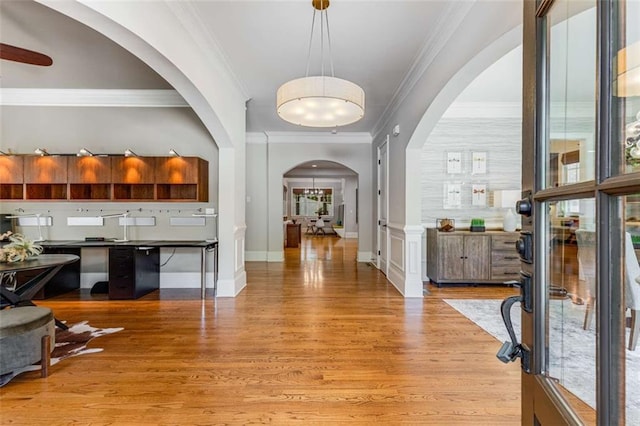 504 S Westminster Way NE, Atlanta, GA 30307 - entryway featuring arched walkways, light wood finished floors, ornamental molding, baseboards, and healthy amount of natural light