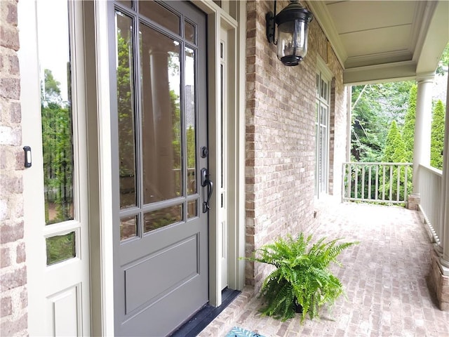 1632 Brookhaven Close NE, Brookhaven, GA 30319 - doorway to property featuring covered porch and brick siding