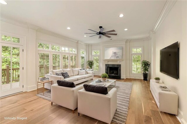 1632 Brookhaven Close NE, Brookhaven, GA 30319 - living room featuring ornamental molding, ceiling fan, a tiled fireplace, light wood-style floors, and recessed lighting