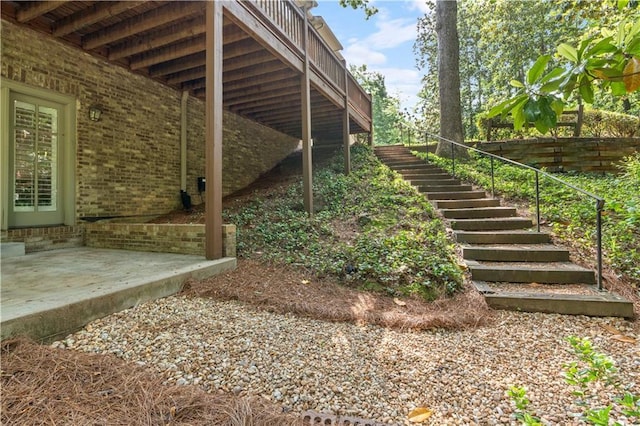 1632 Brookhaven Close NE, Brookhaven, GA 30319 - view of property exterior with stairway and brick siding