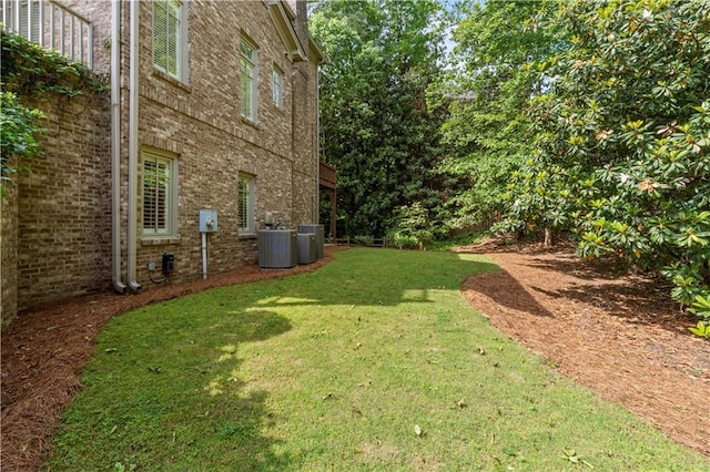 1632 Brookhaven Close NE, Brookhaven, GA 30319 - view of grassy yard featuring central AC unit