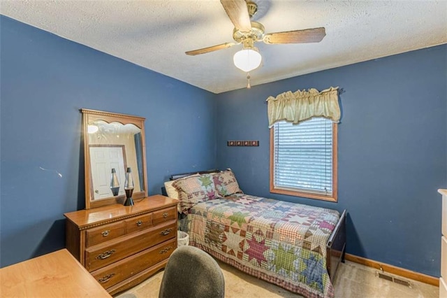 4411 Westerling Ct, Powder Springs, GA 30127 - carpeted bedroom with a textured ceiling and a ceiling fan