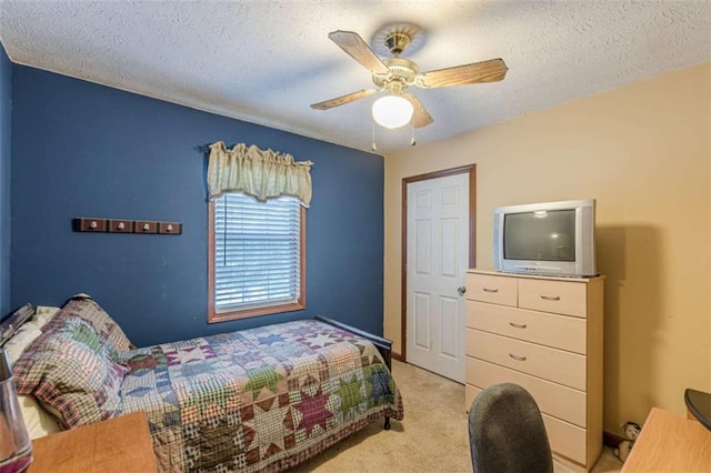 4411 Westerling Ct, Powder Springs, GA 30127 - bedroom featuring light colored carpet, a textured ceiling, and a ceiling fan