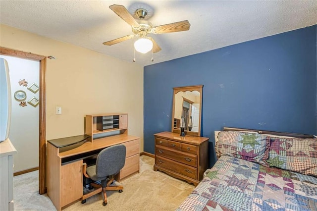4411 Westerling Ct, Powder Springs, GA 30127 - carpeted bedroom featuring a desk, a textured ceiling, and ceiling fan