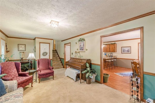 4411 Westerling Ct, Powder Springs, GA 30127 - living area featuring crown molding, a textured ceiling, carpet, and stairs