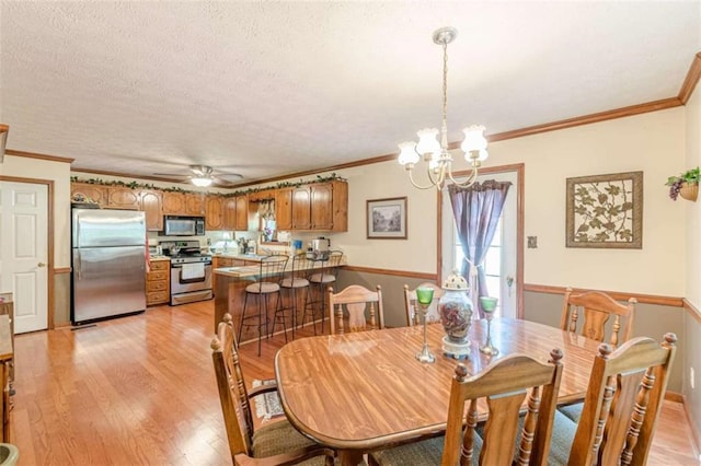 4411 Westerling Ct, Powder Springs, GA 30127 - dining room with light wood-style flooring, a chandelier, ornamental molding, ceiling fan, and a textured ceiling