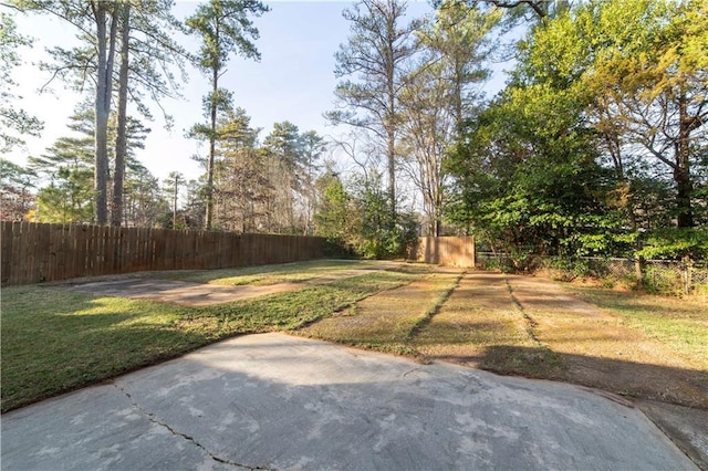 view of yard featuring a patio and fence