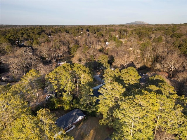 bird's eye view featuring a wooded view