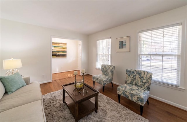 living room with wood finished floors and baseboards