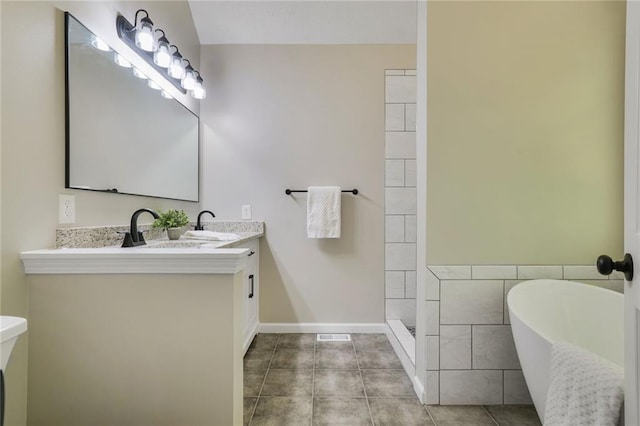 232 Barrett Springs Way, Canton, GA 30115 - bathroom featuring a soaking tub, double vanity, tile patterned flooring, a shower, and baseboards