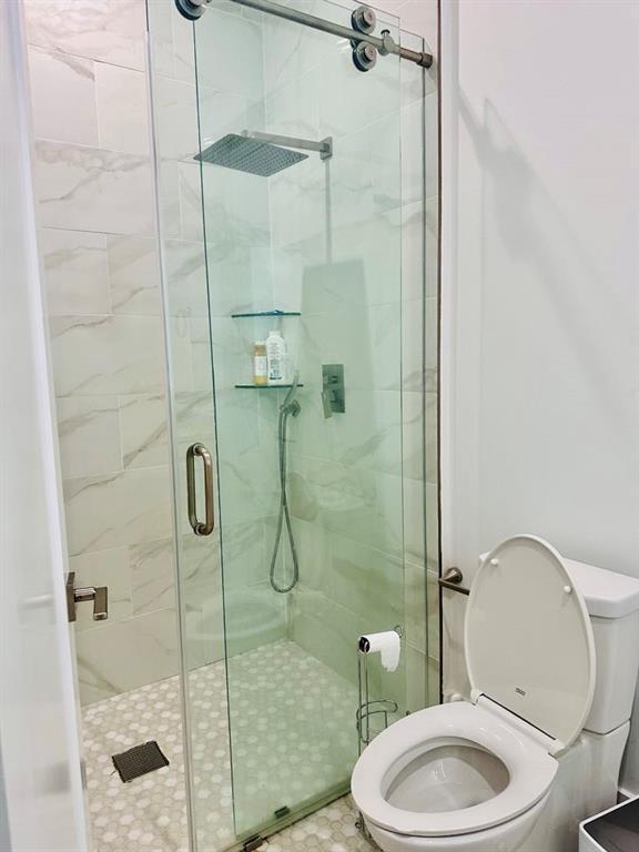 2964 Old Peachtree Rd, Dacula, GA 30019 - bathroom featuring toilet and a stall shower