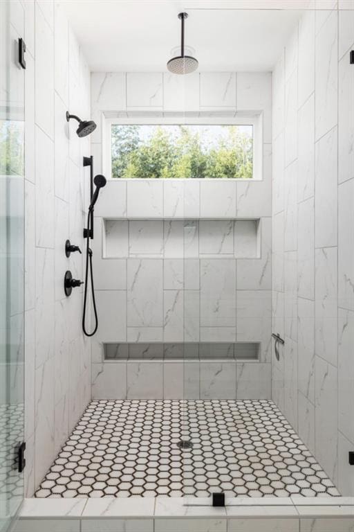 bathroom with a shower stall